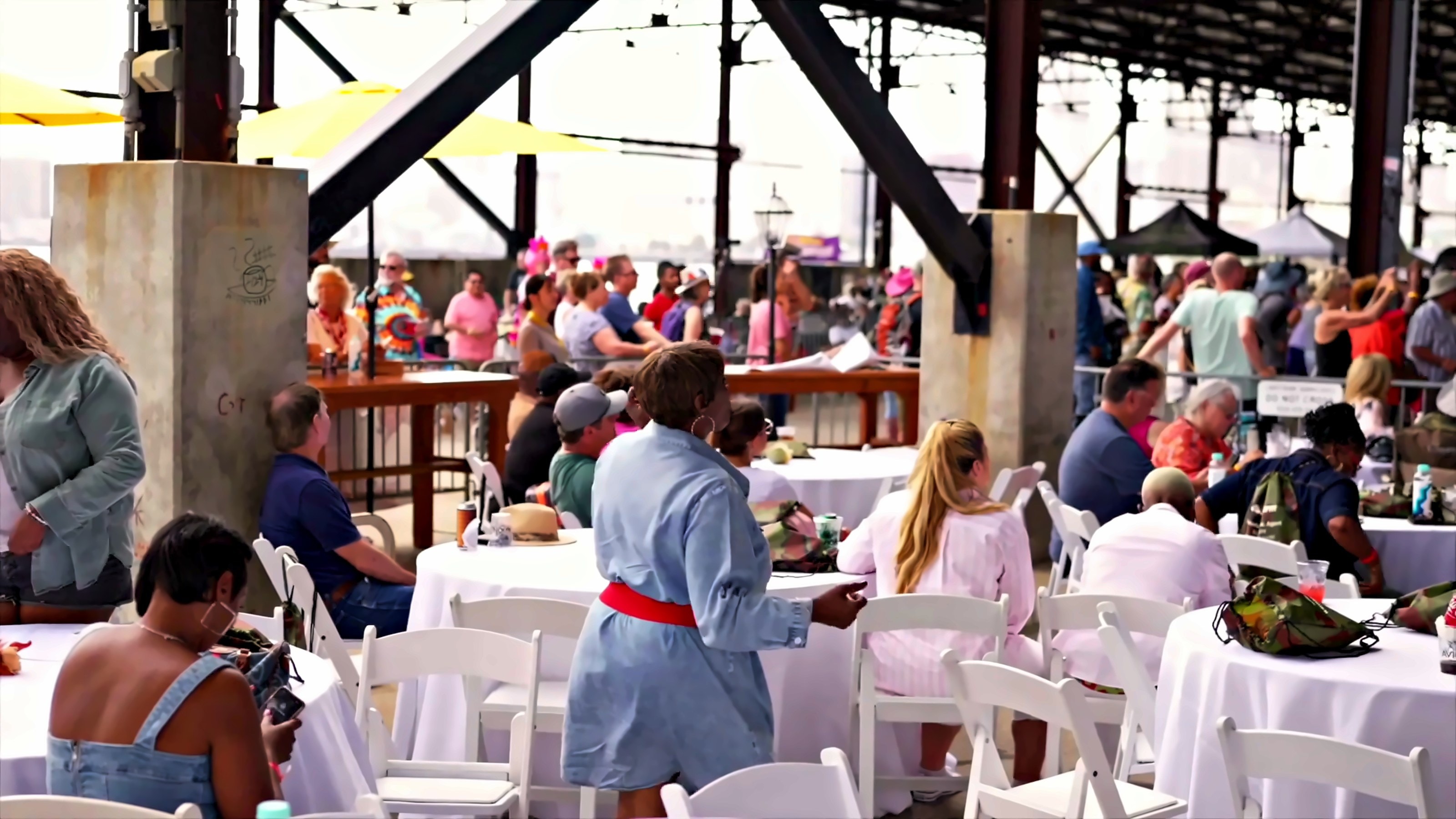 Guests at white-clothed VIP tables at NOLA Zydeco Fest 2025