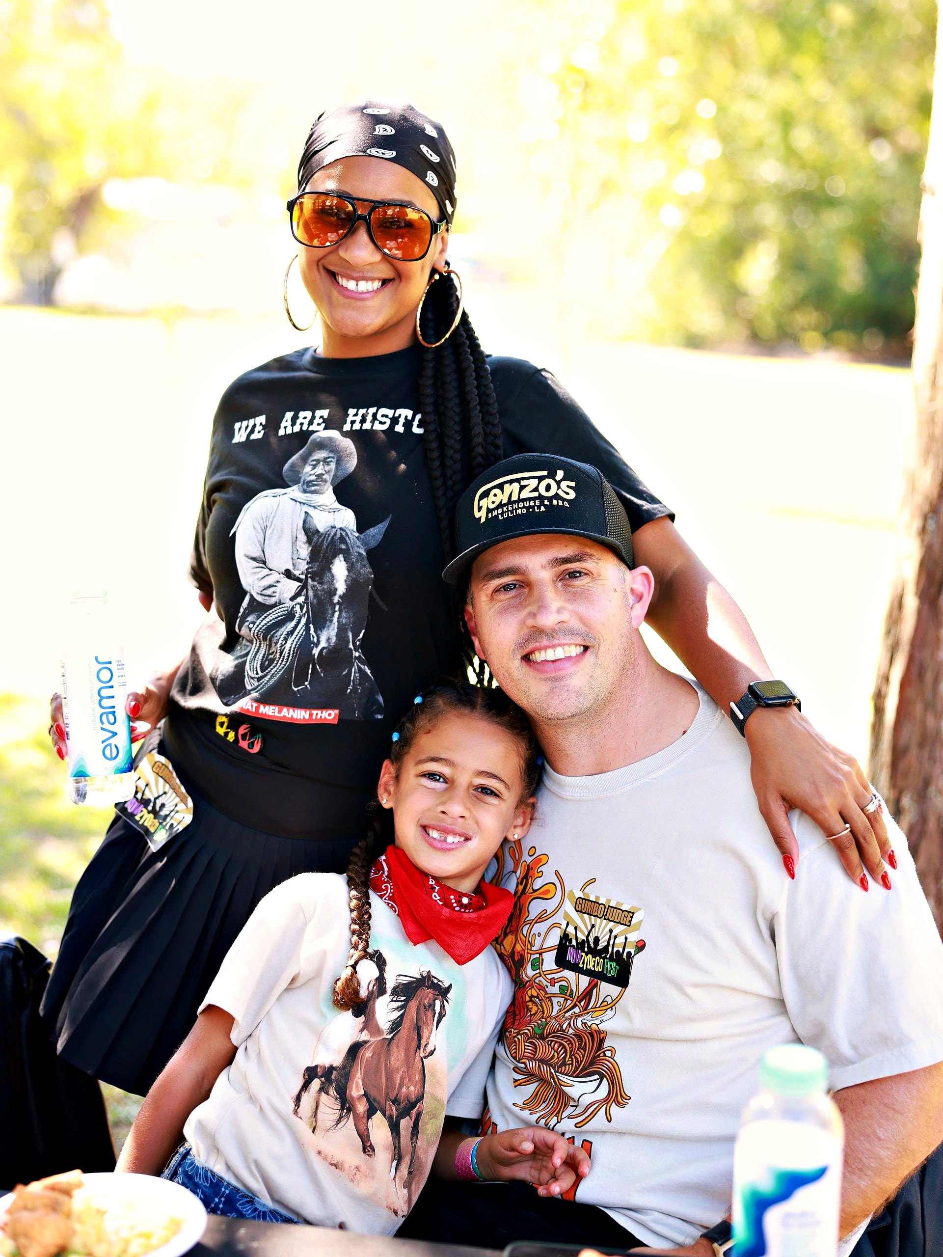 A family smiling together at the festival