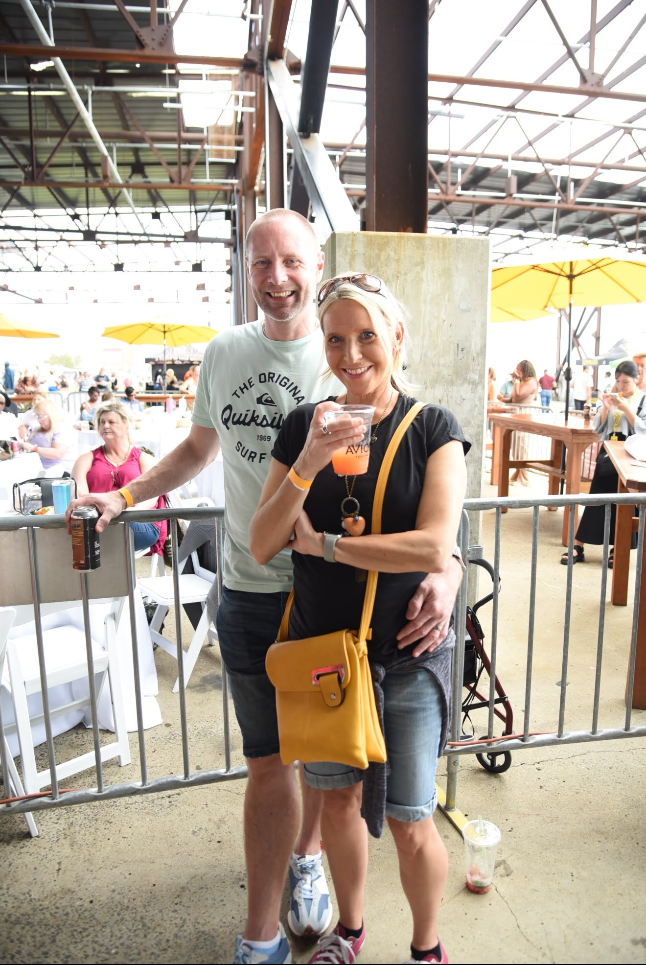 A couple raising a cocktail at the festival