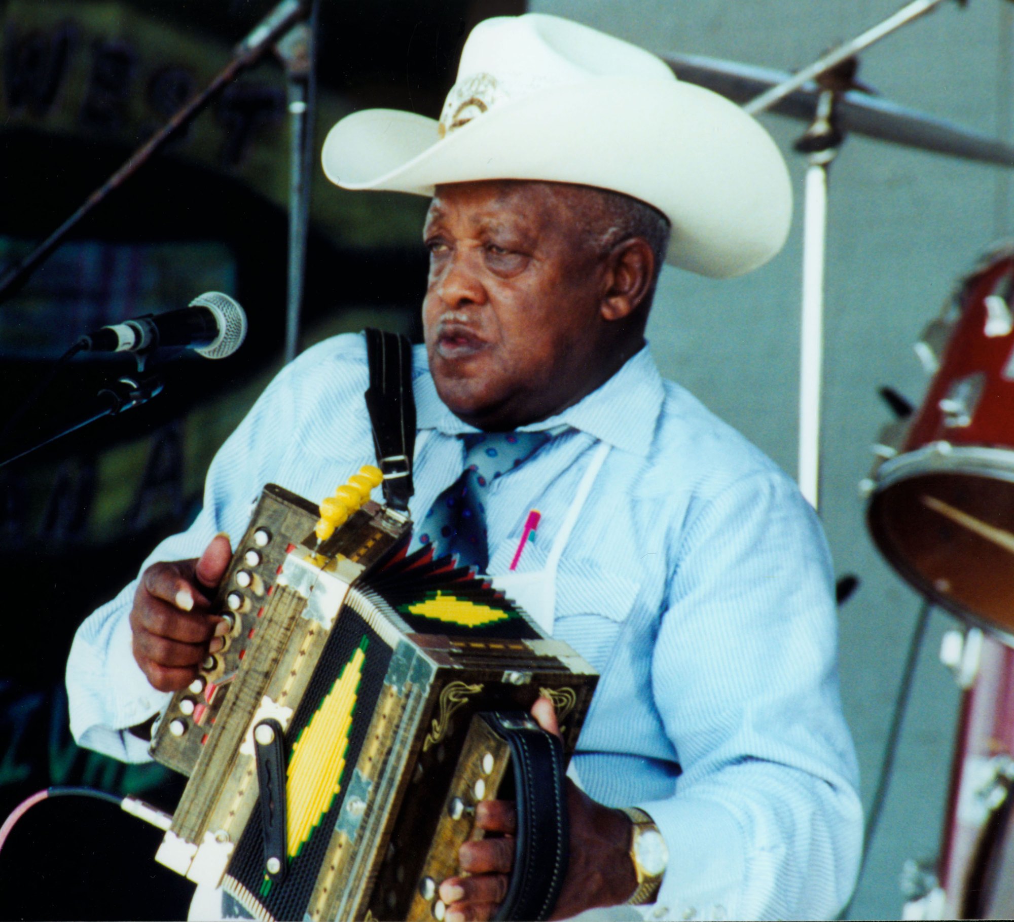Boozoo Chavis in a white cowboy hat playing accordion, 2000